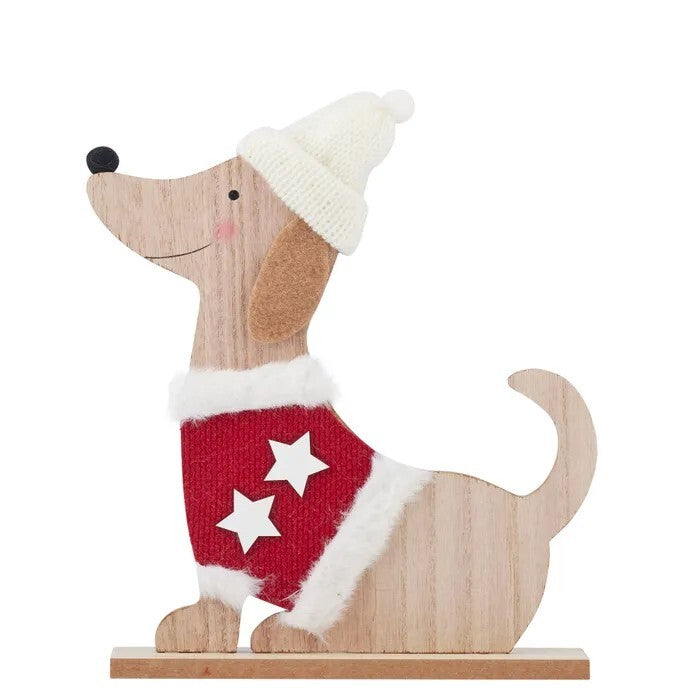 Wooden ornament of a sitting dog wearing a red jumper with white stars