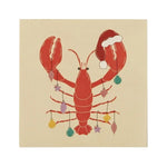 Napkins in a natural base colour featuring lobsters adorned with a Christmas hat and decorations