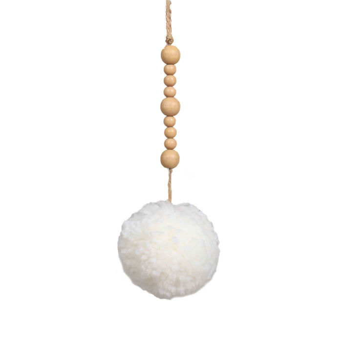 White pom pom hanging from natural-coloured wooden beads