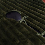 Olive coloured tree skirt made from faux faur and a ribbed pattern