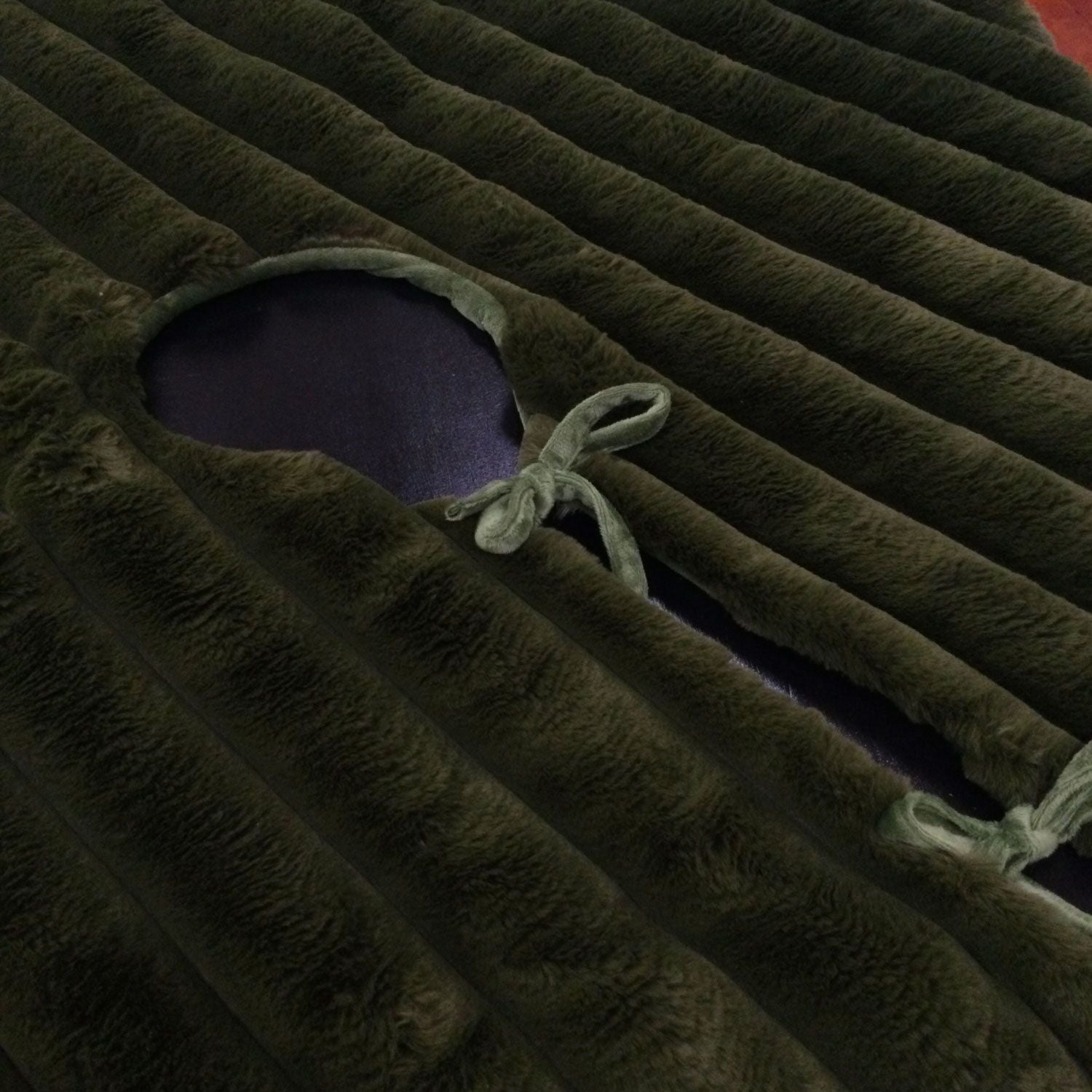 Olive coloured tree skirt made from faux faur and a ribbed pattern