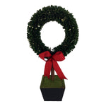 Decorative topiary wreath with cubic base and red bow