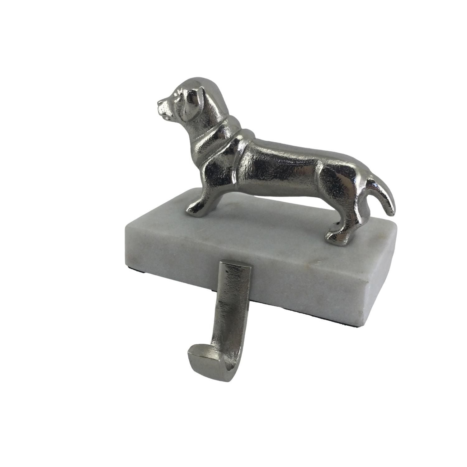 A sausage dog ornament attached to a block with hook for hanging Christmas stockings