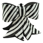 Tree stand in the shape of a black and white striped bow