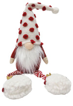 Plush gnome wearing white hat with red fluffy spots and fluffy shoes