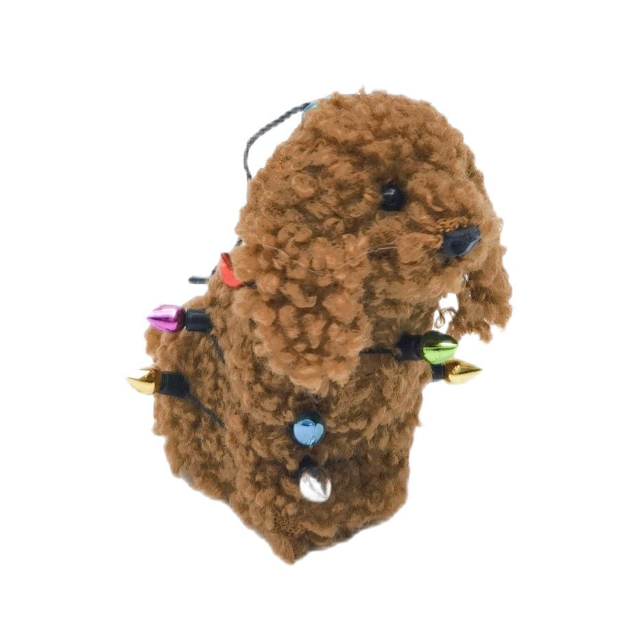 Brown fluffy cavoodle dog wrapped in Christmas lights hanging ornament
